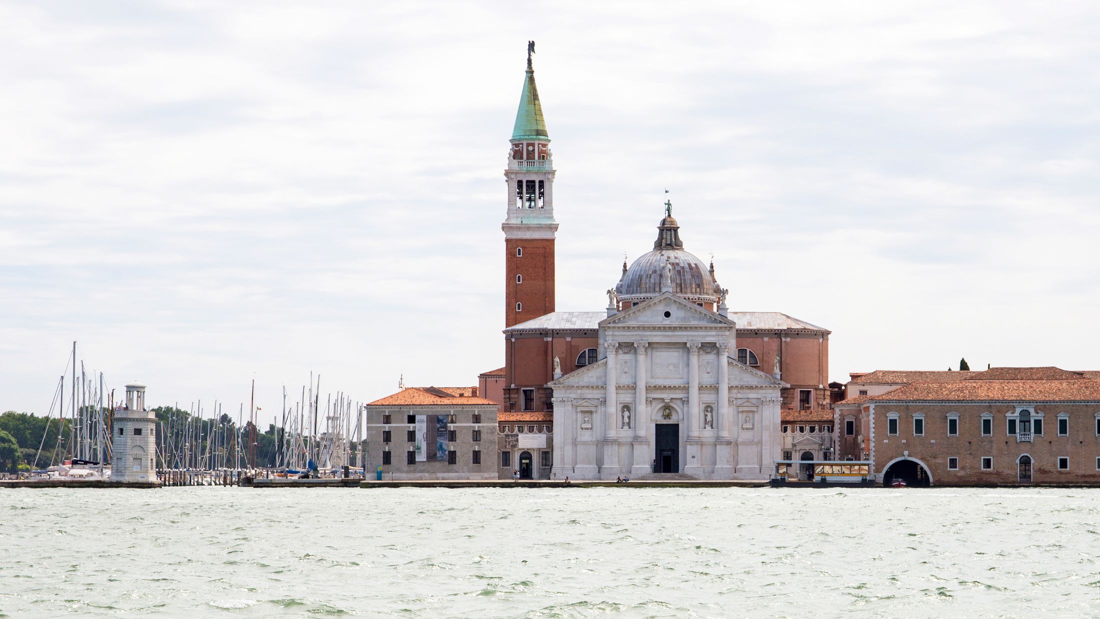 a castle with water in front of a building