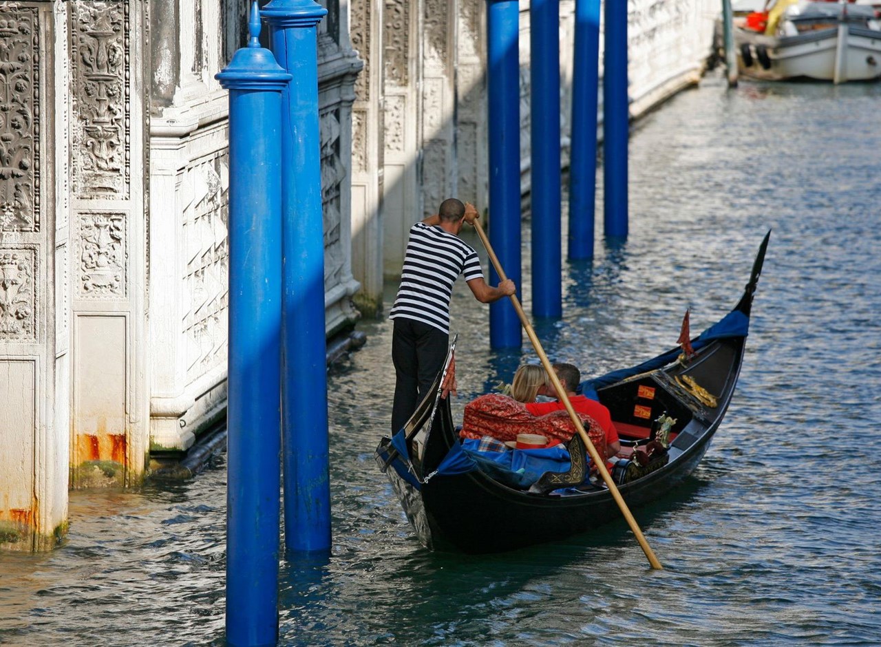 a person sitting on a boat in the water
