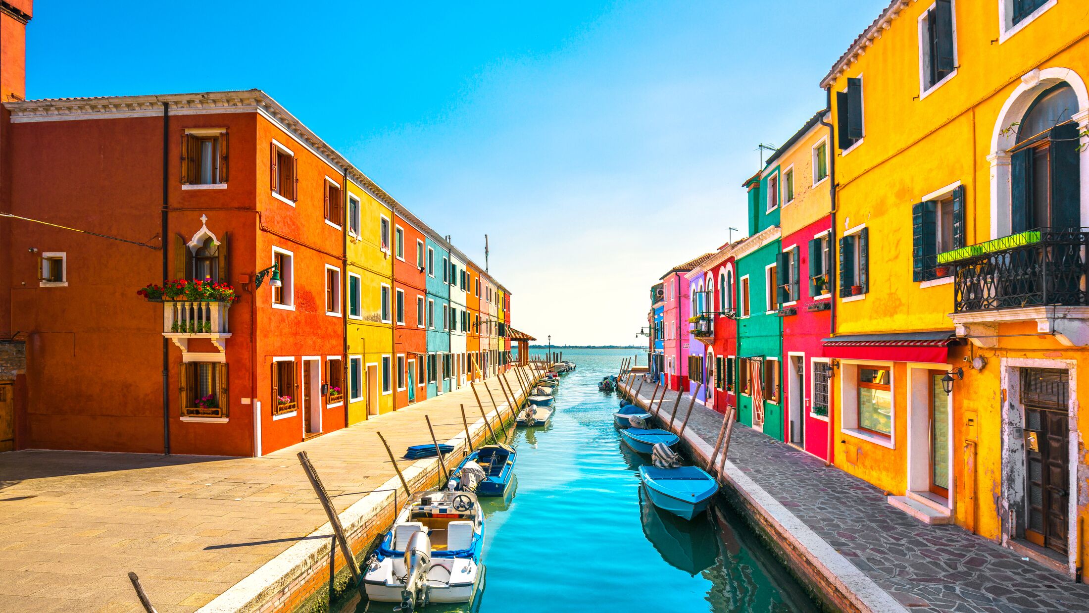 Burano island canal, colorful houses and boats, Venice Italy Europe