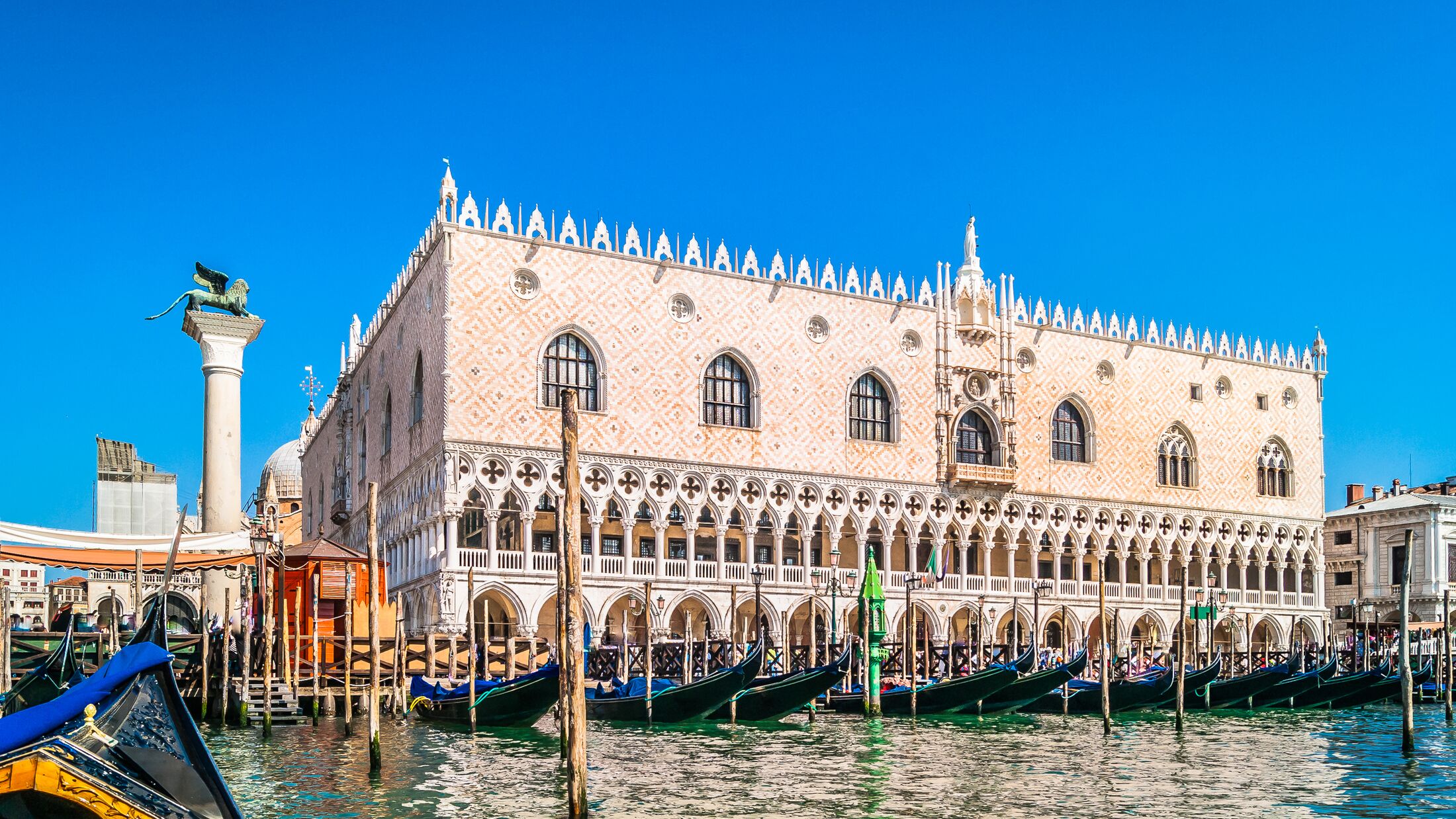 Waterfront view at Doge's Palace in famous Venice city, view from gondola ride. / Doge's Palace waterfront view. / Selective focus.