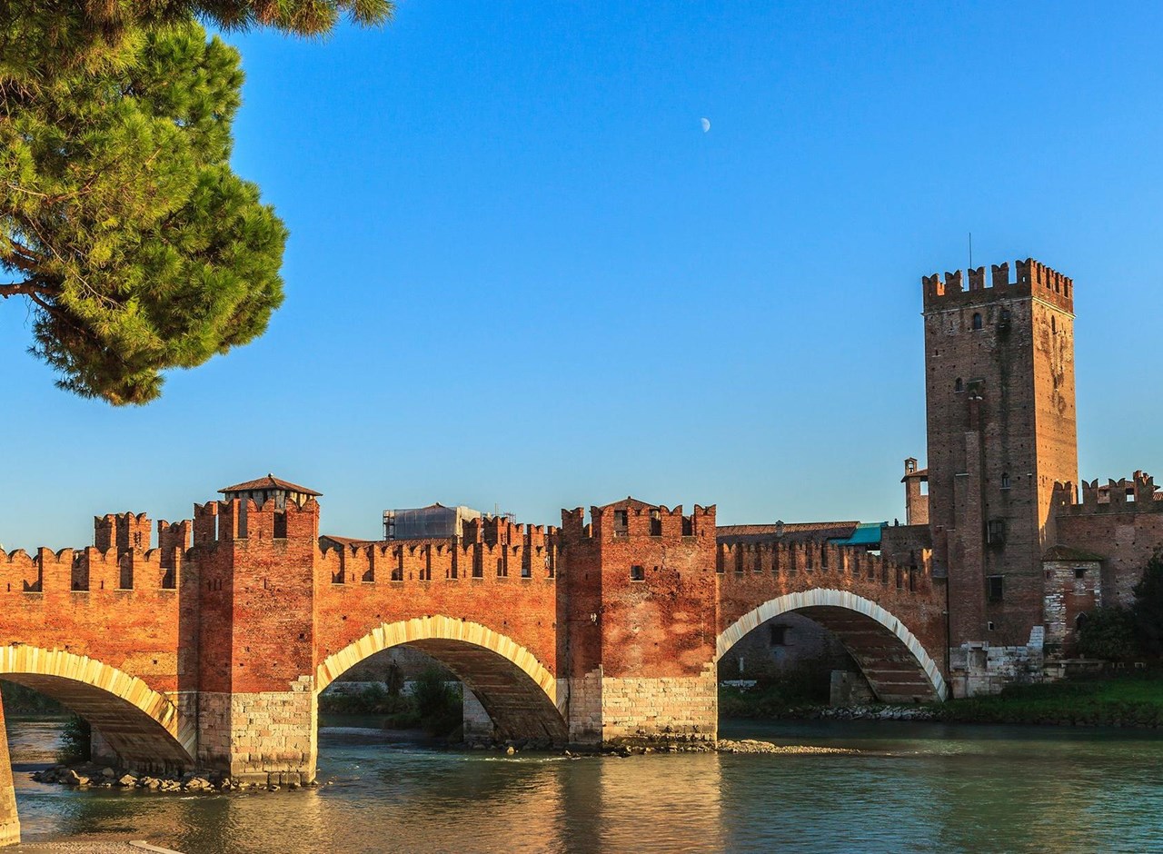 a bridge over a river in a city
