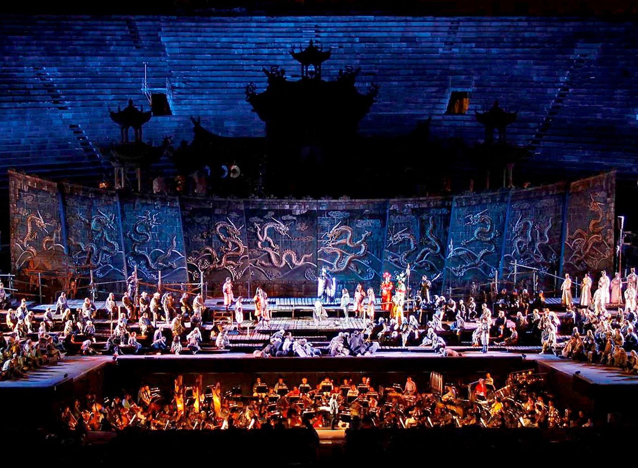 a group of people on a stage in front of a crowd