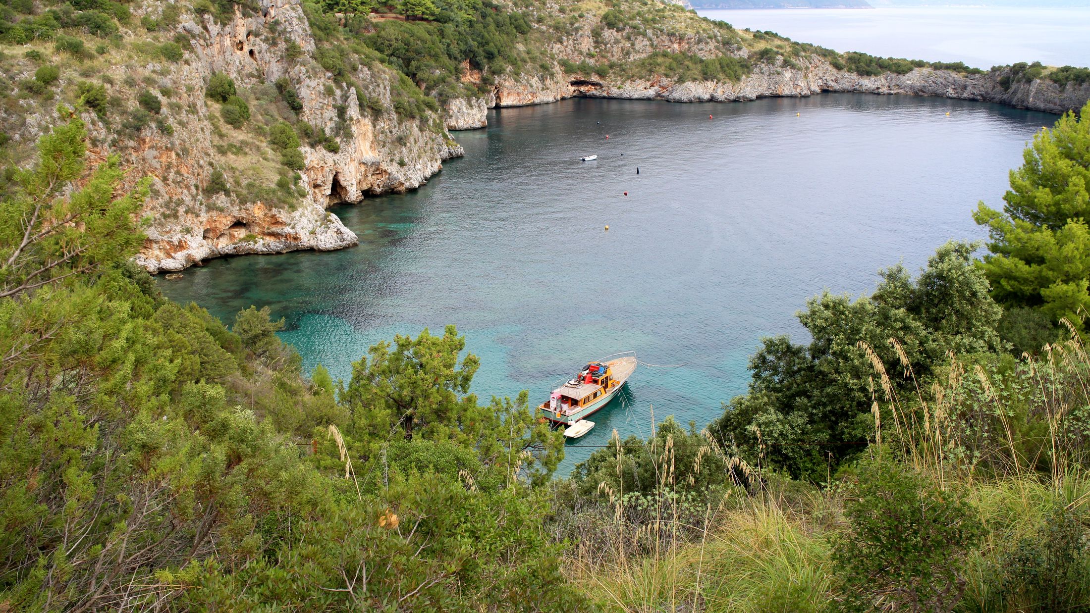 A small boat in a body of water