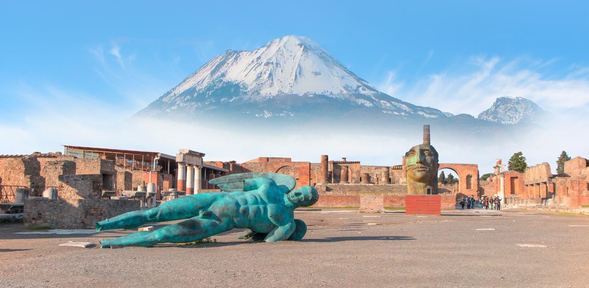 Ancient Roman city of Pompeii on the background Vesuvius volcano