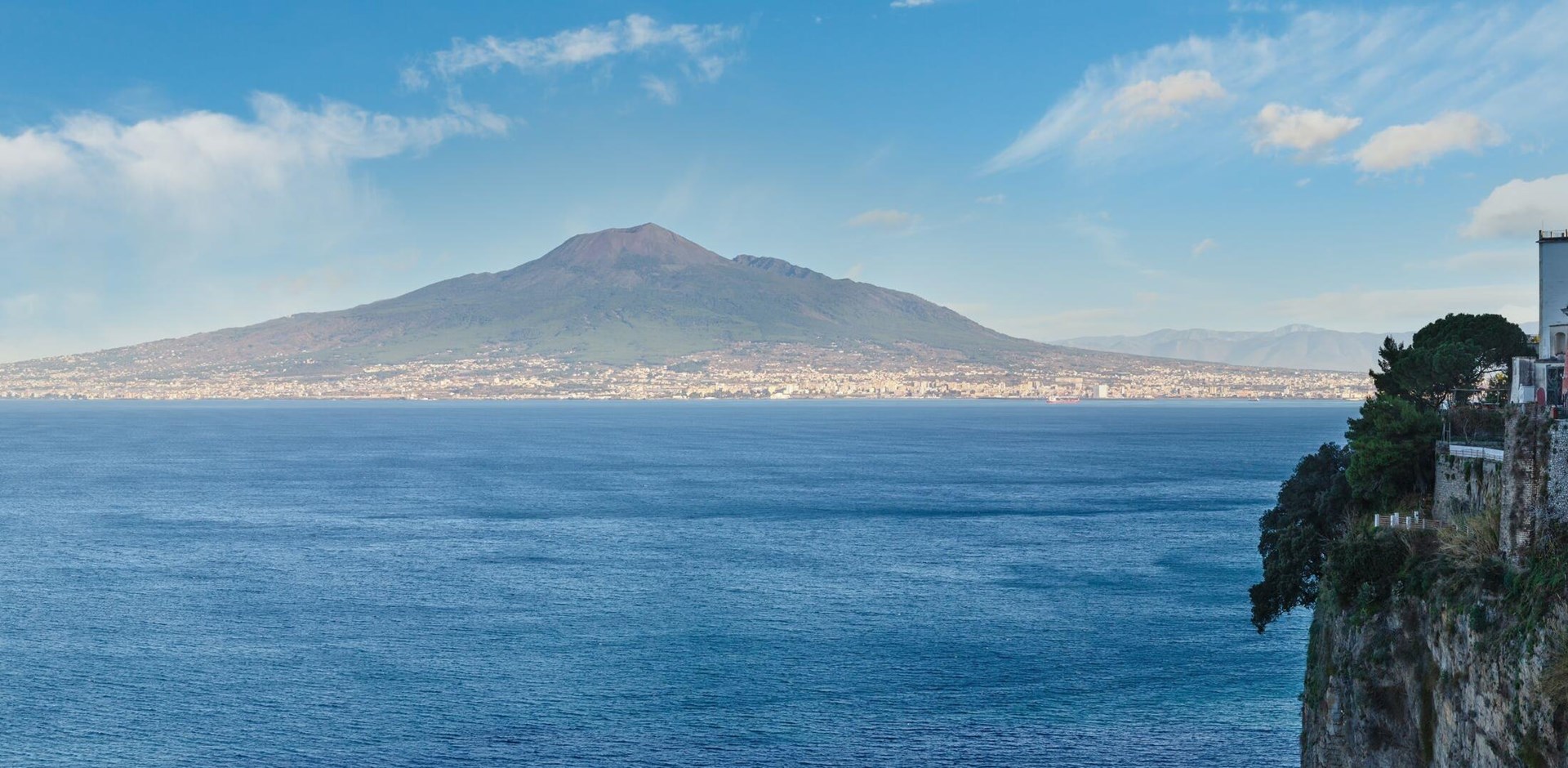 View from Sorrento town on Naples coast and Mount Vesuvius. Sea coastline panorama (Italy).