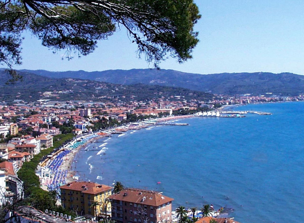 a view of a large body of water with a city in the background