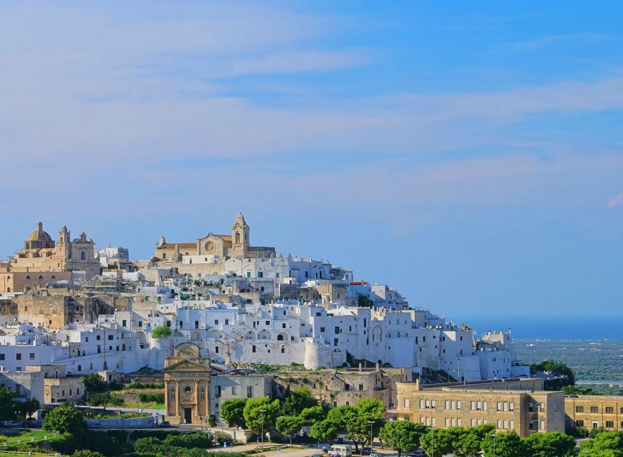 a castle on a hill in front of a building