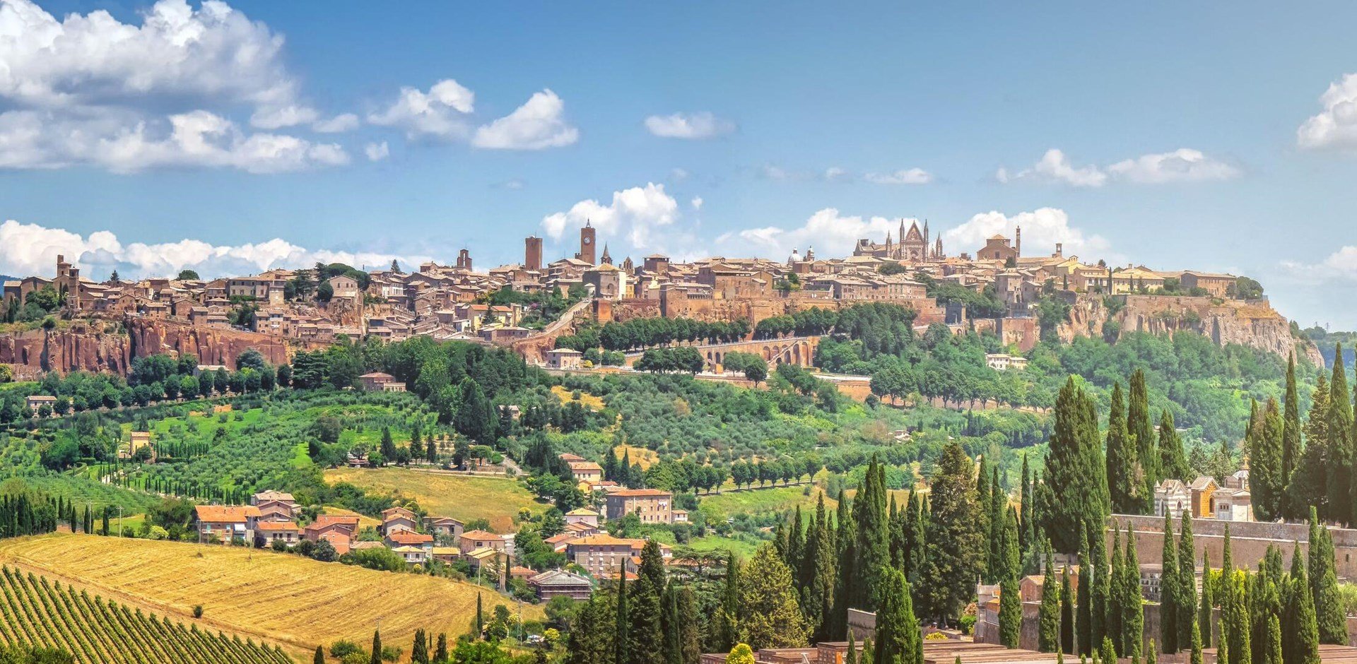 Beautiful panoramic view of the ancient etruscan town of Orvieto on a sunny day with blue sky in summer, Umbria, Italy