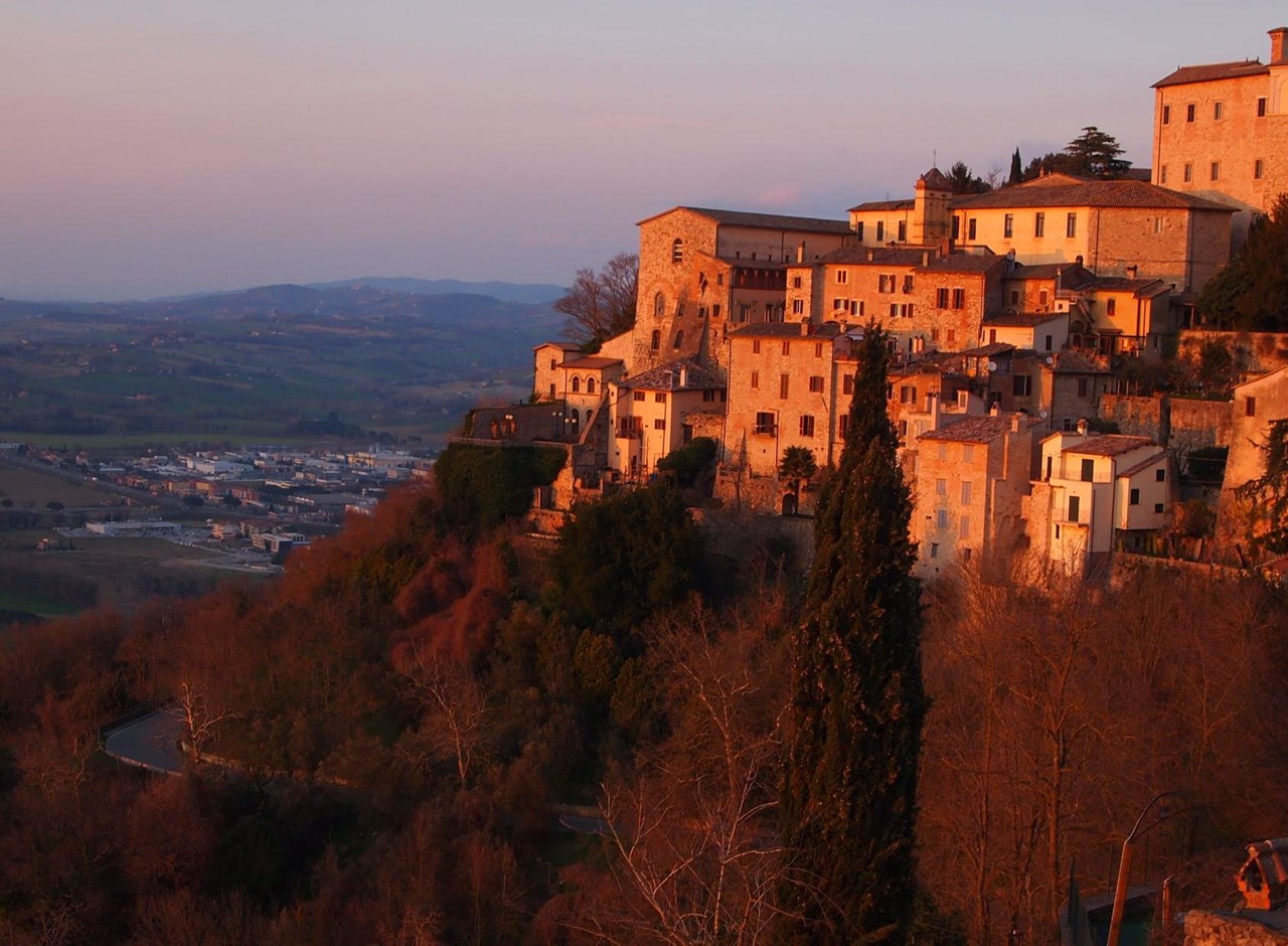a castle with a mountain in the background