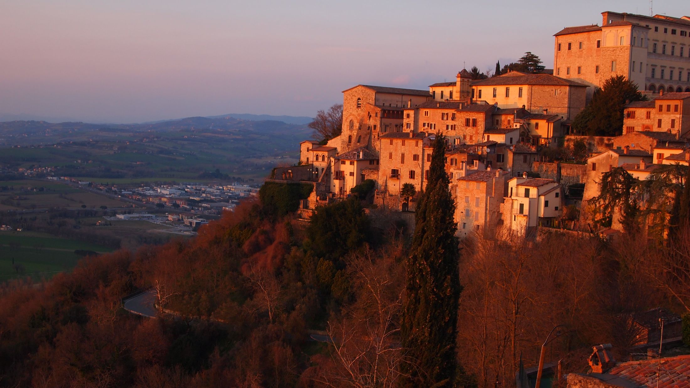 a castle with a mountain in the background