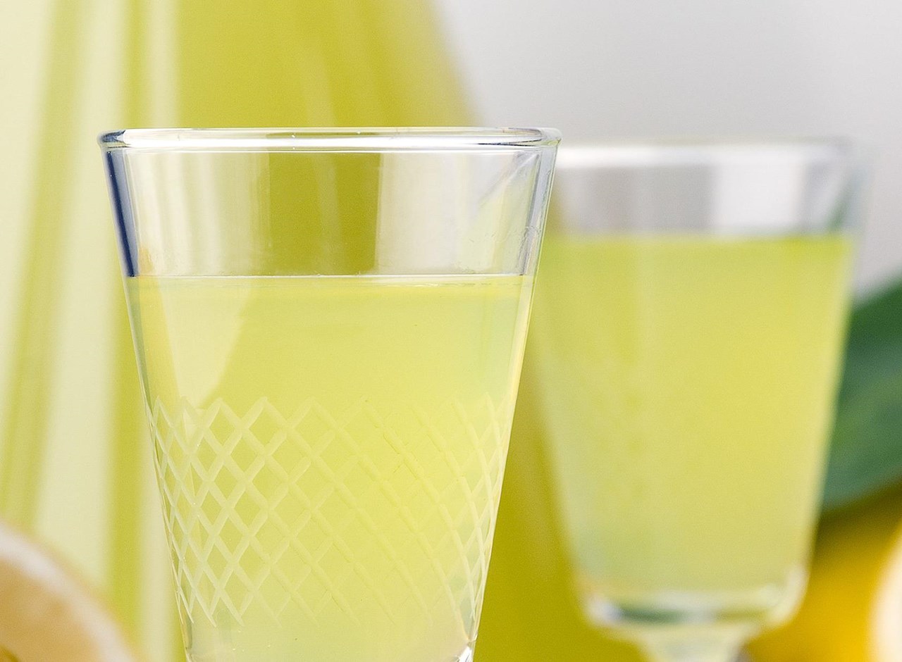a close up of a beverage in a glass cup on a table