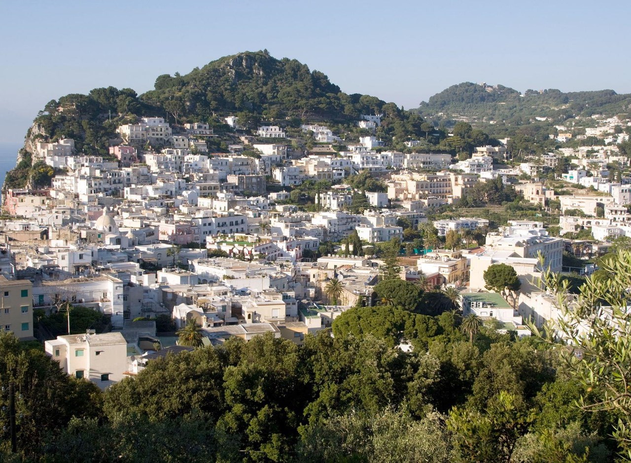 a large body of water with a city in the background