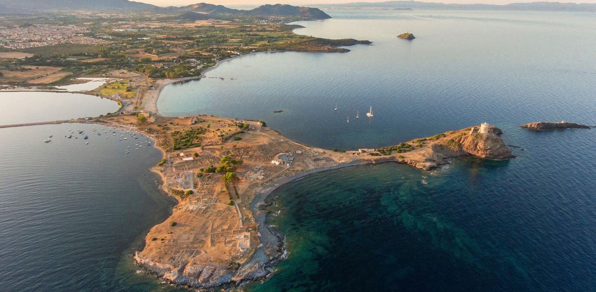 Top view with drone of Nora archaeological site at sunset Sardinia, Italy.