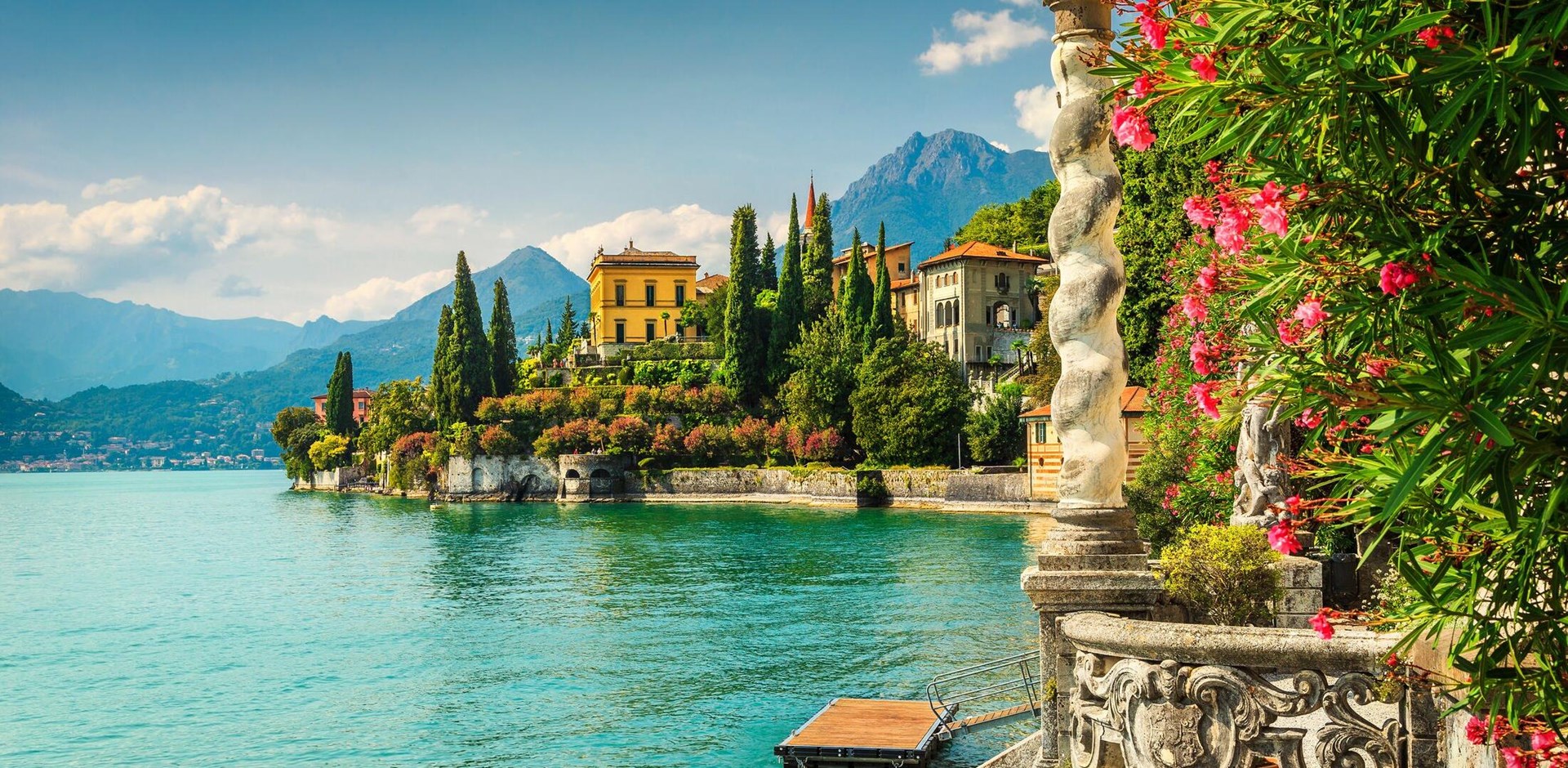 Famous luxury villa Monastero, stunning botanical garden decorated with mediterranean oleander flowers, lake Como, Varenna, Lombardy region, Italy, Europe