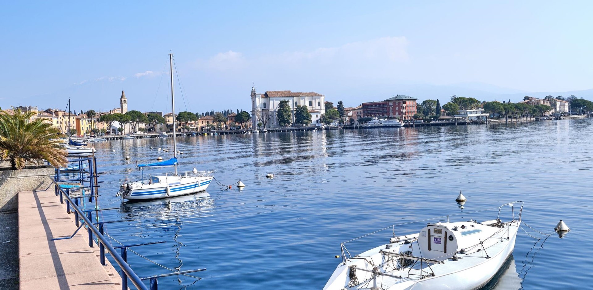 Gardone Riviera, Italy: View of Gardone Riviera at the lakeside of Lake Garda in spring. Gardone Riviera is a popular holiday location in northern Italy.