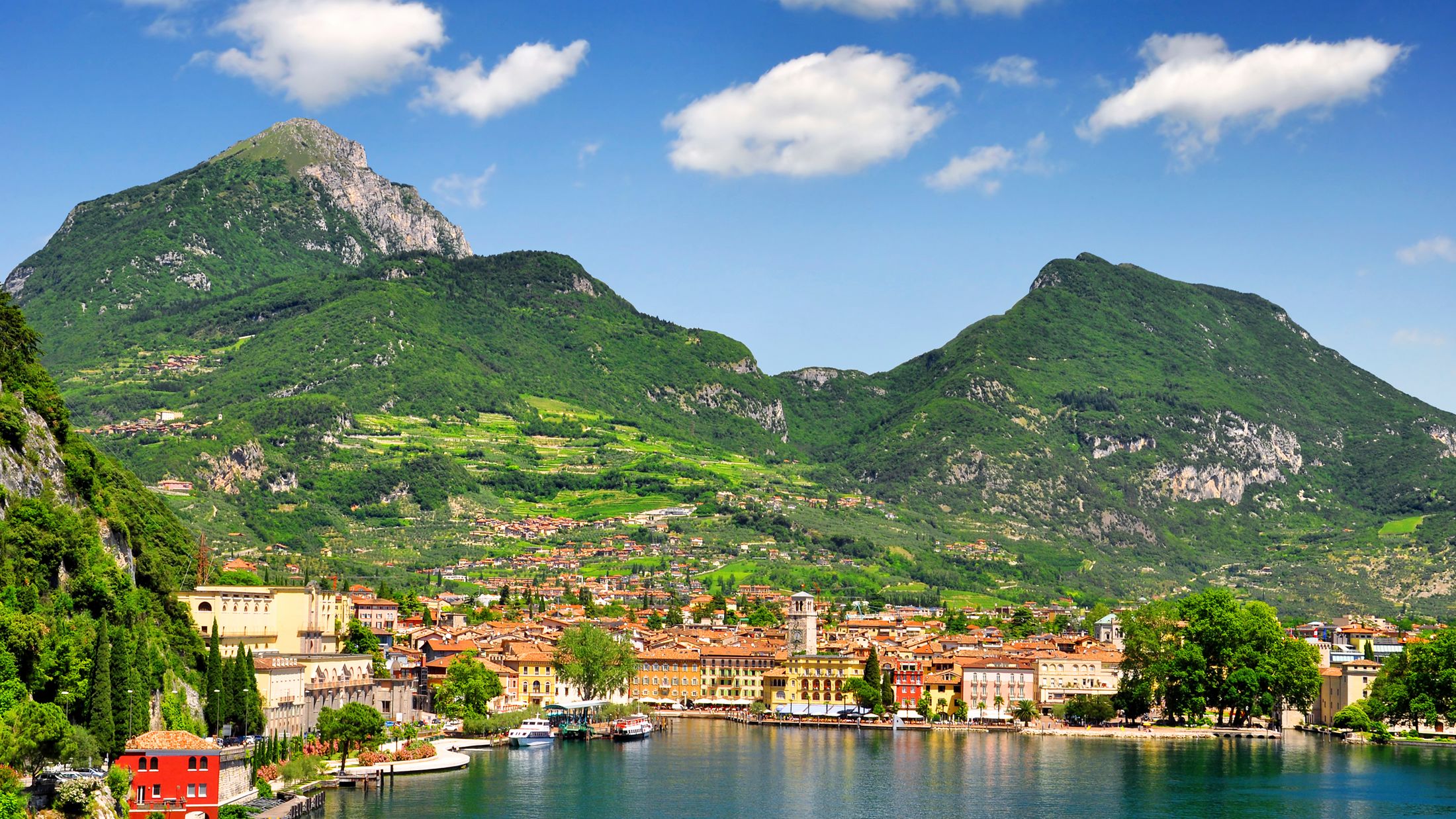 a large body of water with a mountain in the background