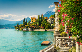 Famous luxury villa Monastero, stunning botanical garden decorated with mediterranean oleander flowers, lake Como, Varenna, Lombardy region, Italy, Europe