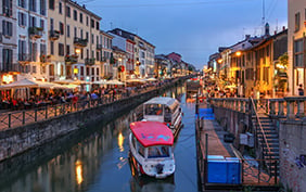 Evening scene along the Naviglio Grande canal in Milan, Italy.