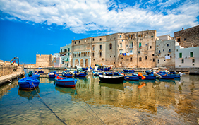 Old port of Monopoli province of Bari, region of Apulia, southern Italy. Boats in the marina of Monopoli.