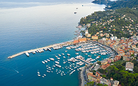 Panoramic view of a harbor in Ligurian Sea, Santa Margherita Ligure, Italy. Colorful houses on a seashore