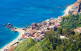 Aerial view of Giardini Naxos, comune in Messina on Sicily Island, Italy. It is situated on coast of Ionian Sea between Cape Taormina and Cape Schiso.