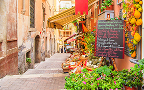 Entrance to local shop in Taormina, Sicily. Writing on the black table lists itmes on promotion.