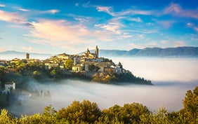 Trevi picturesque village in a foggy morning. Perugia, Umbria, Italy, Europe.