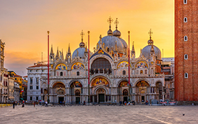 View of Basilica di San Marco and on piazza San Marco in Venice, Italy. Architecture and landmark of Venice. Sunrise cityscape of Venice.