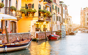 Small romantic water canal with restaurants in Dorsoduro region in Venice