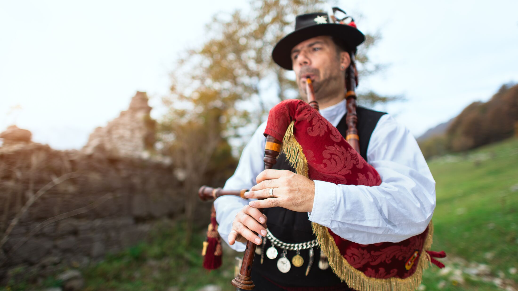 Typical player in traditional bergamo bagpipe from the alpine valleys of northern Italy.