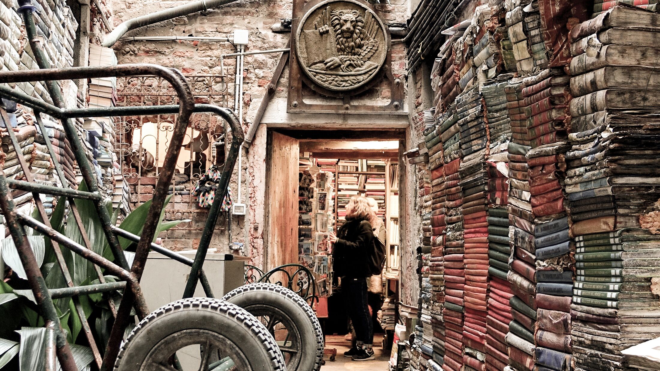 the entrance of an old historical bookstore in Venice, Italy.