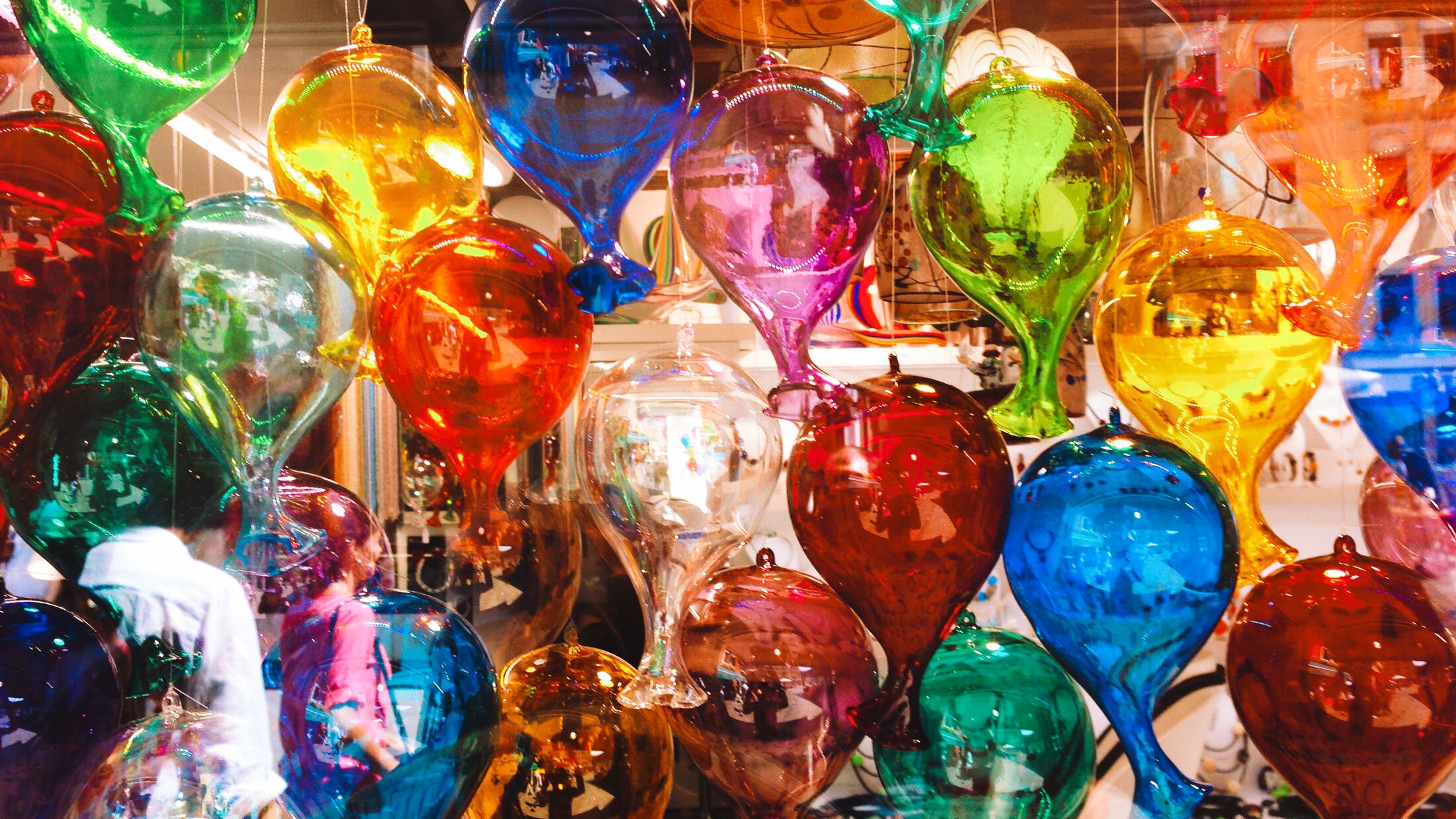 Coloured glass balloons in a shop window in Venice, Italy.