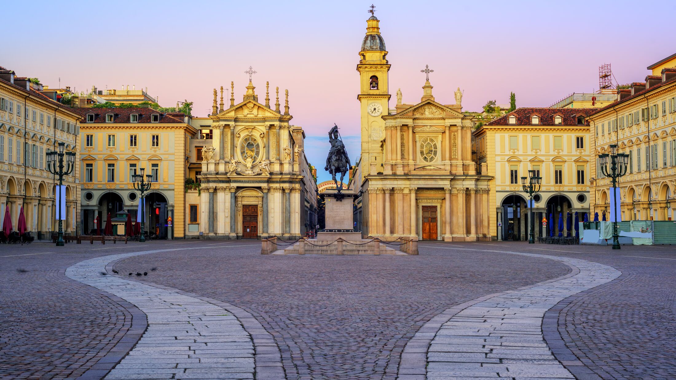Piazza San Carlo square and twin churches of Santa Cristina and San Carlo Borromeo in the Old Town center of Turin, Italy, on sunrise