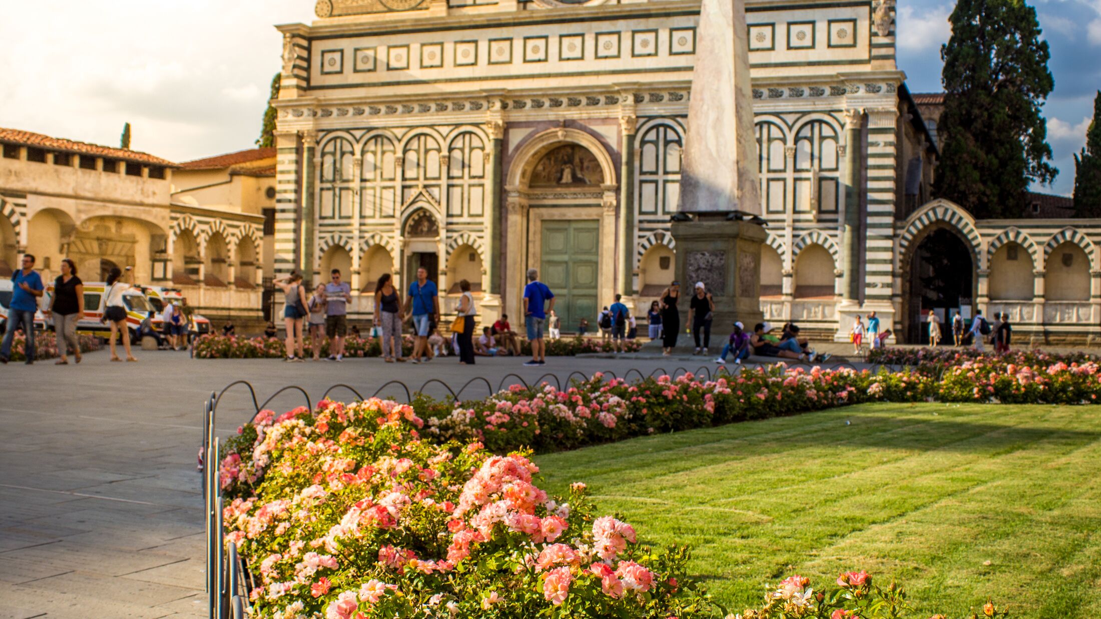 Santa Maria Novella in pink flowers in a summer day. Florence, Italy