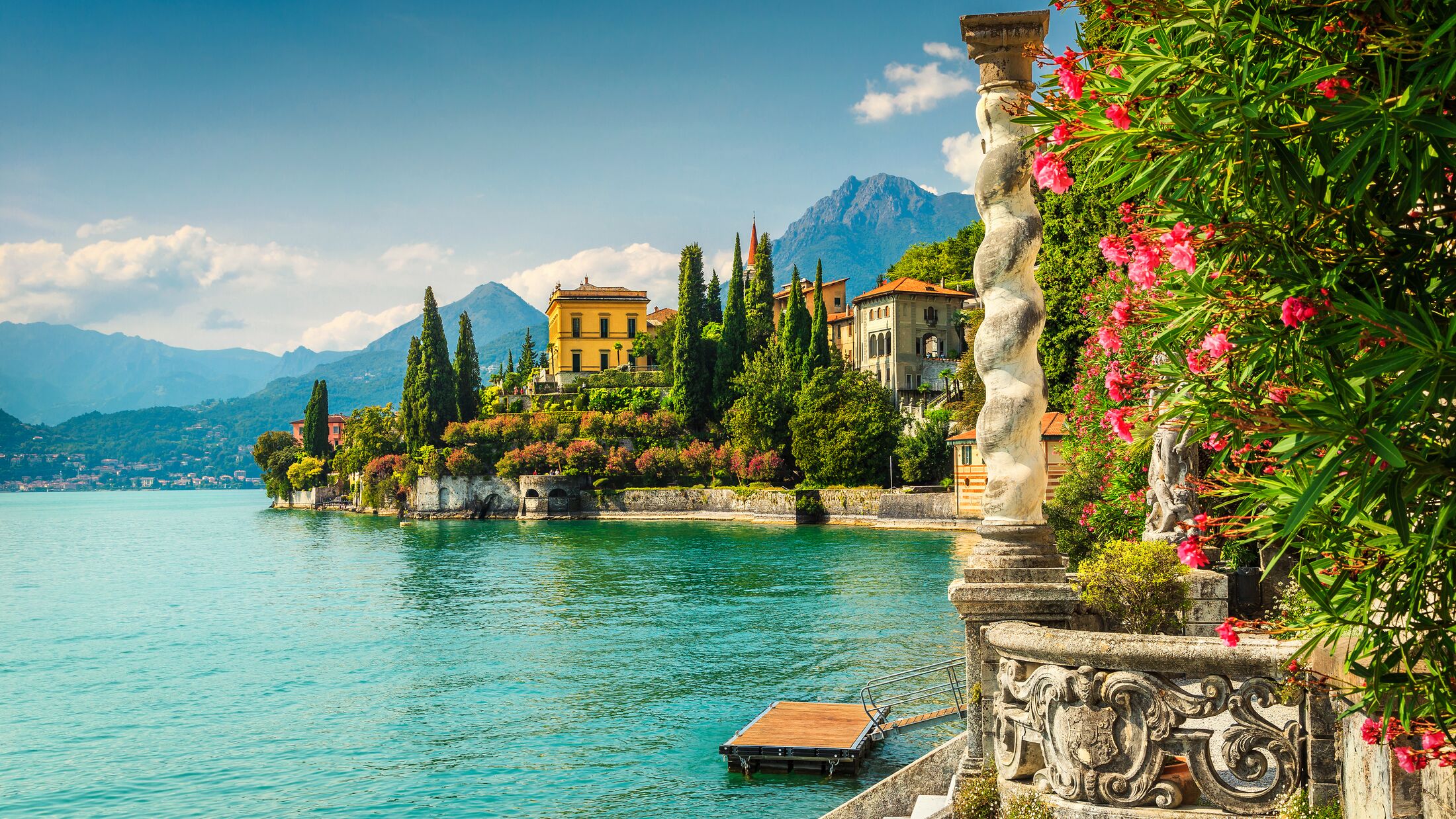 Famous luxury villa Monastero, stunning botanical garden decorated with mediterranean oleander flowers, lake Como, Varenna, Lombardy region, Italy, Europe