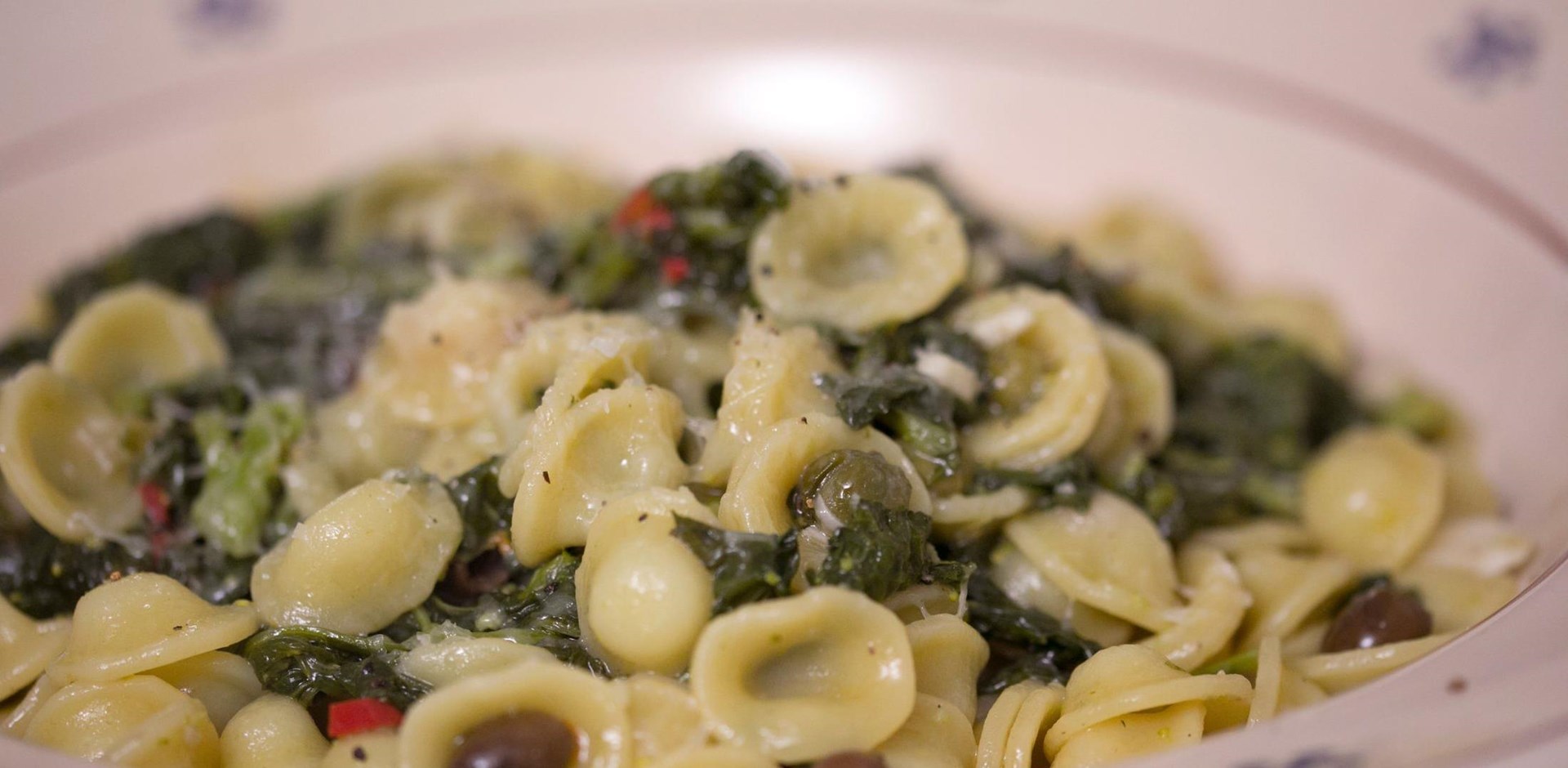 a close up of pasta in a white bowl