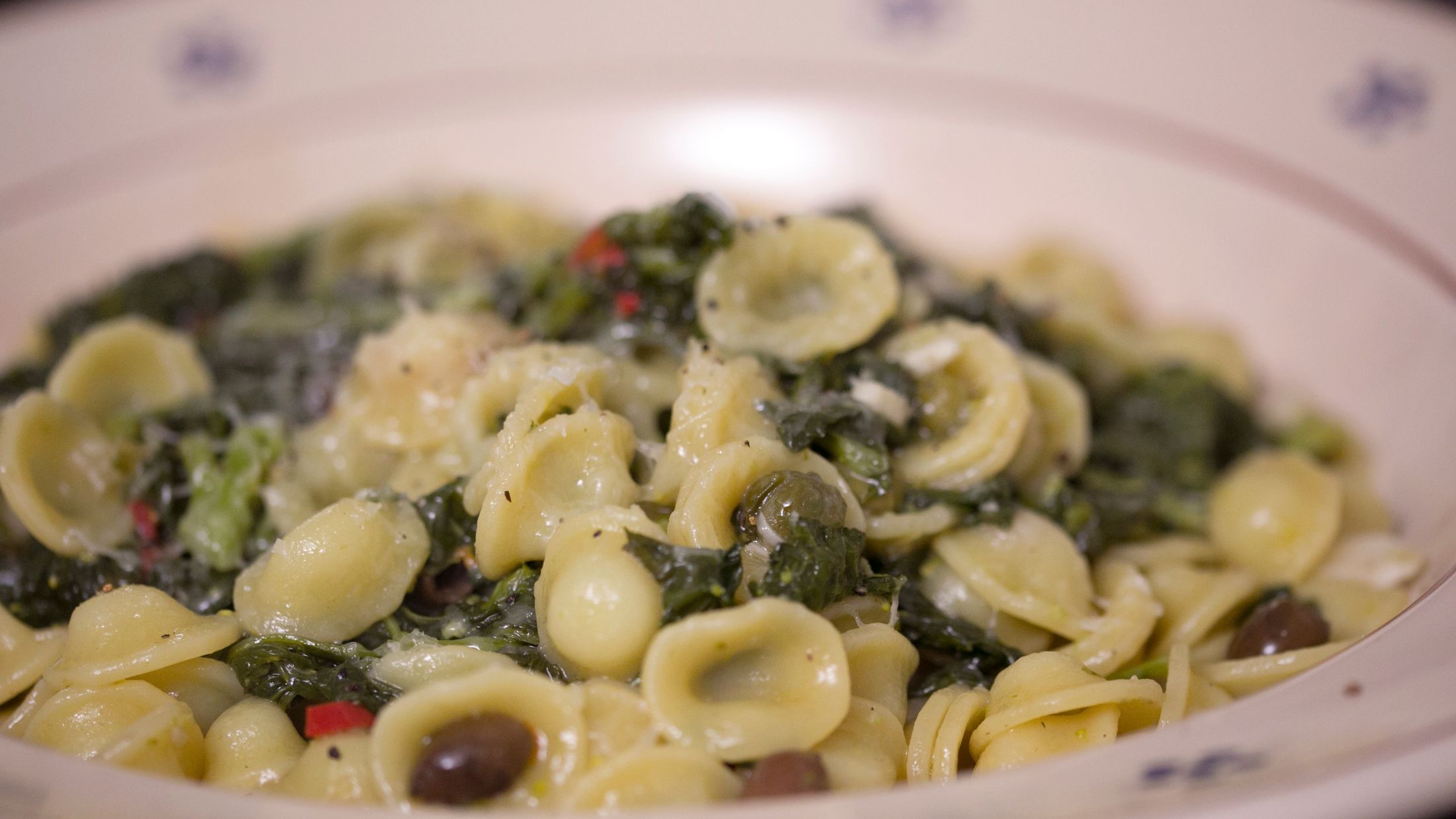 a close up of pasta in a white bowl