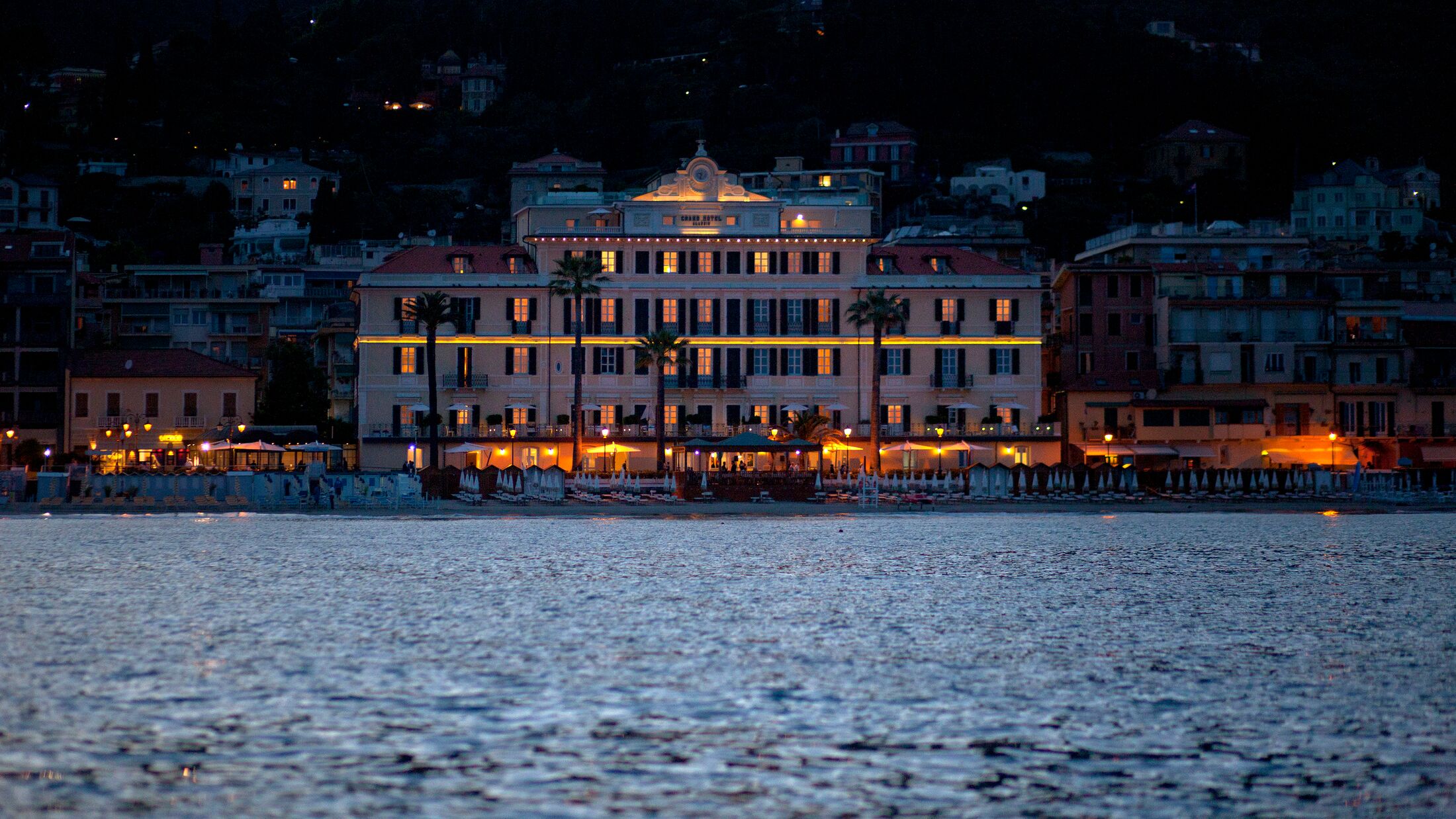 a large body of water with a city in the background