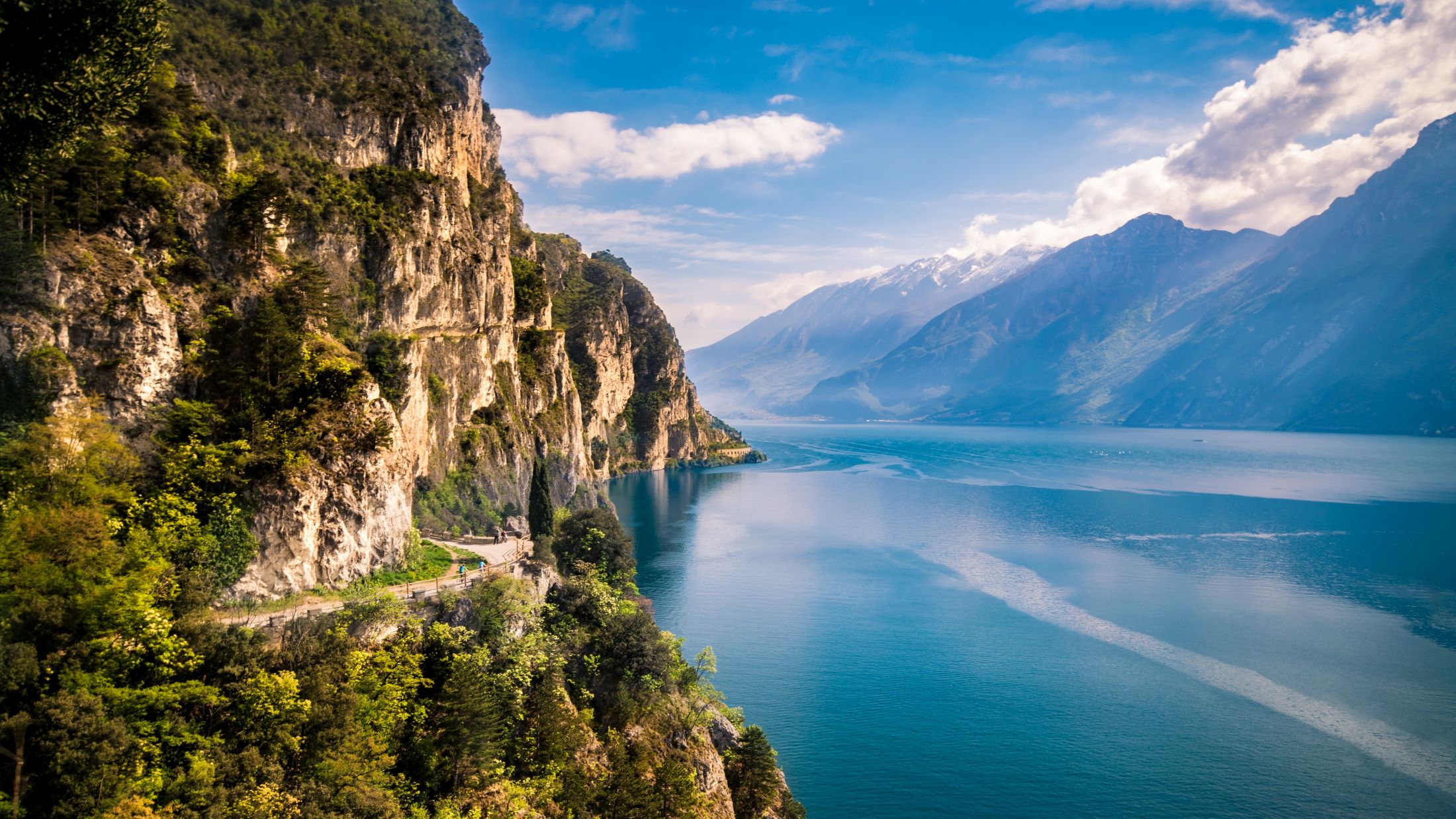 a body of water with a mountain in the background