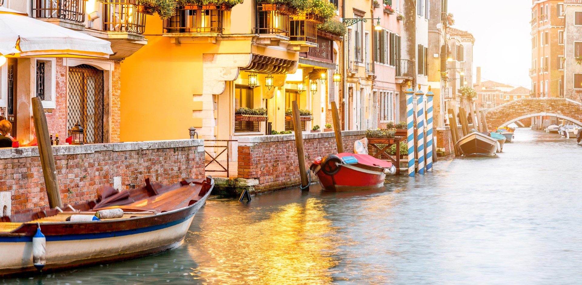 a boat is docked next to a body of water